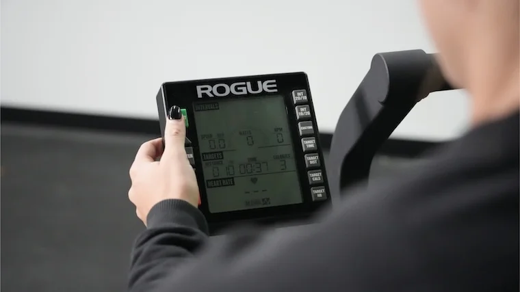rouge-echo-air-bike-close-up-pressing-start-button-on-screen-controls Our tester toggling through the settings available on the Rogue Echo Air Bike console