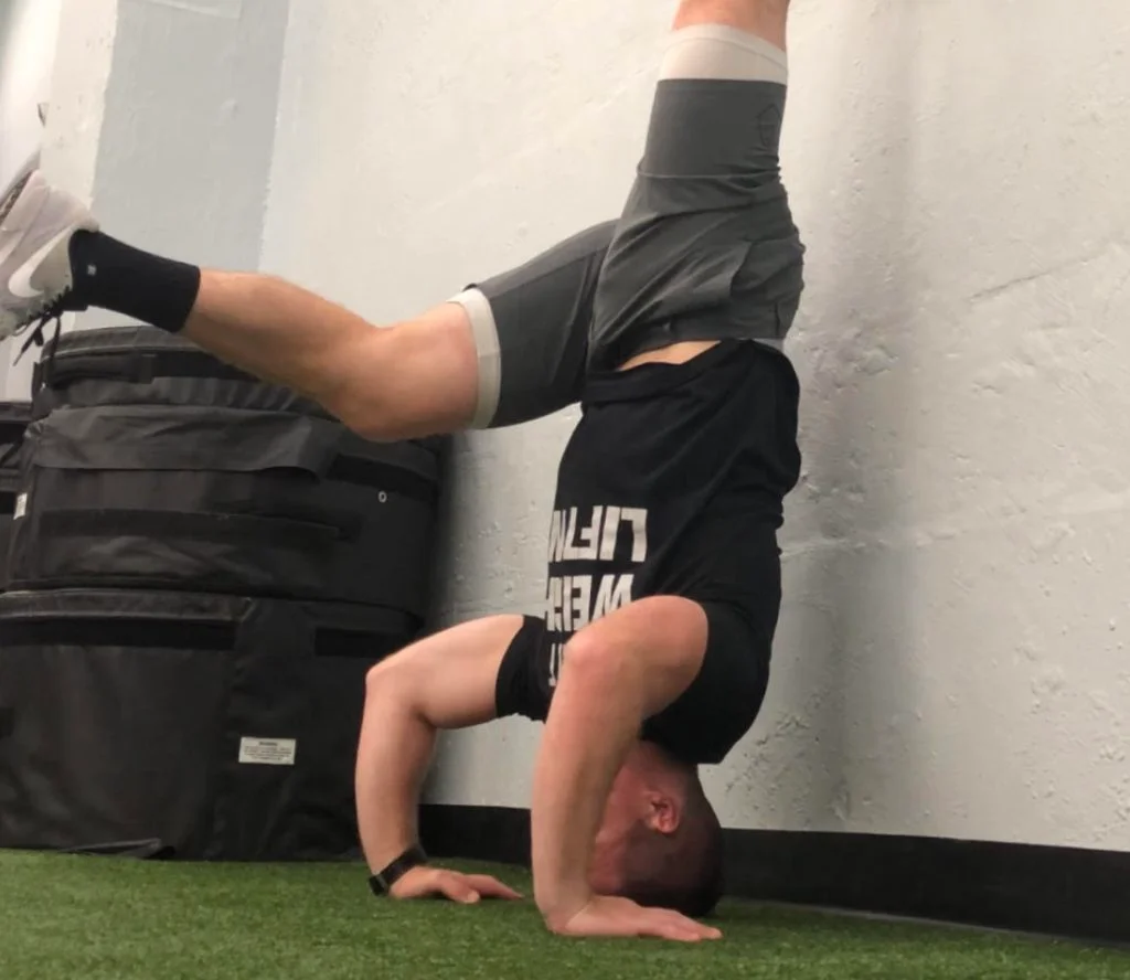Handstand Push Up Kick Up