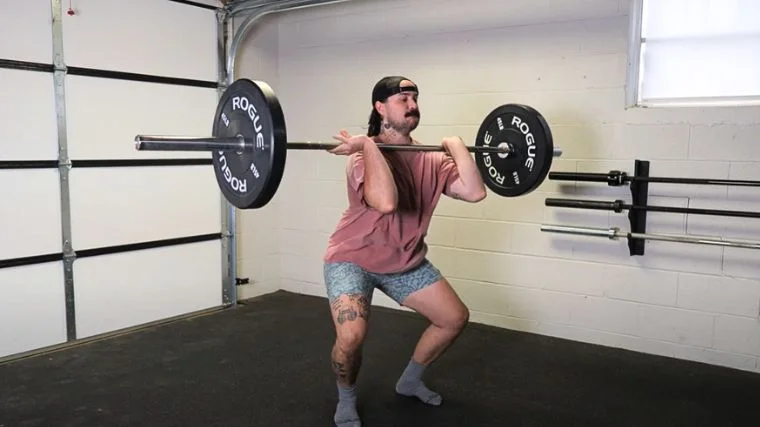 A person performing the power clean exercise.