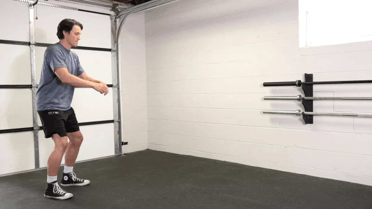 A person performing the broad jump exercise.
