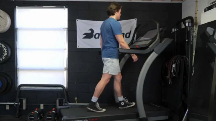 BarBend's Jake Herod  walking on a treadmill.