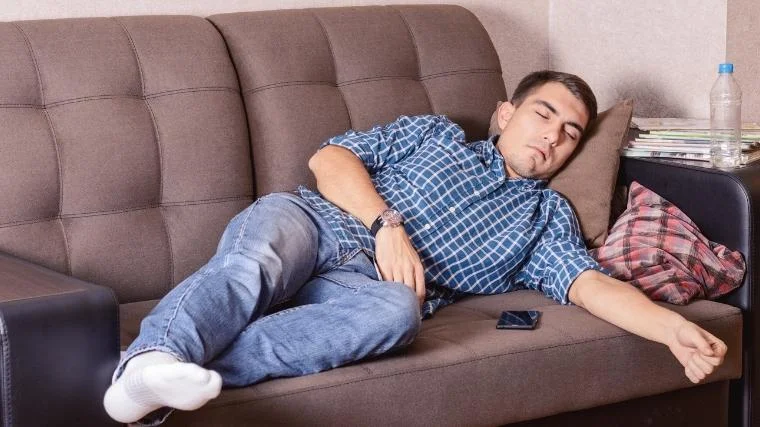 Man asleep on couch