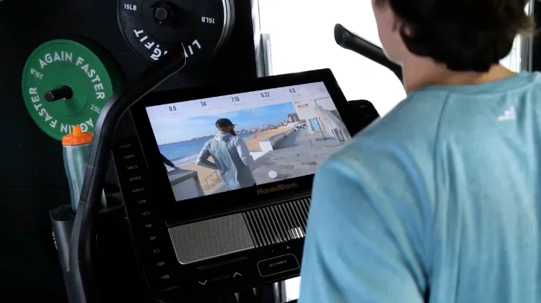 A BarBend tester Following an iFIT Class on the NordicTrack Commercial X22i.