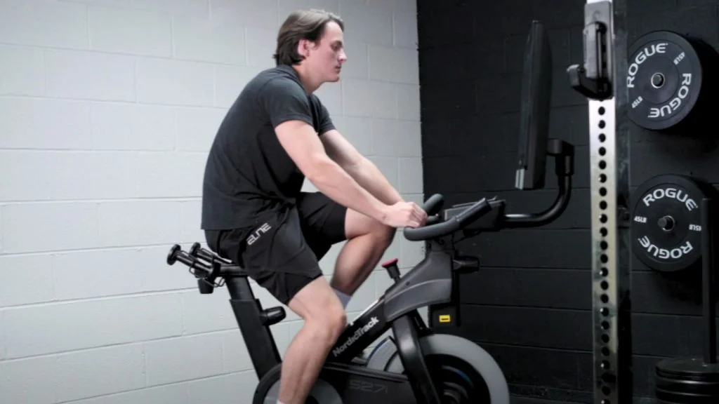 Jake working out on an exercise bike.