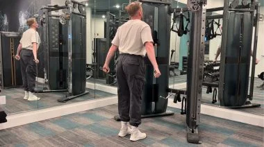 What Is the FITT Principle? Our tester performing the cable cross body triceps extension movement.