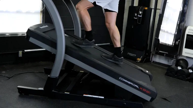 Our tester using a steep incline on the NordicTrack Commercial X22i.