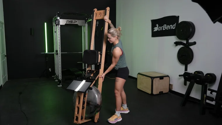Our tester lifting the Ergatta Lite to store upright.
