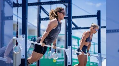 Two athletes are shown competing at the Dewey Beach competition.
