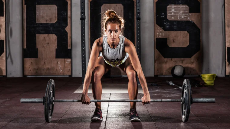 A person doing heavy deadlift exercise in gym.