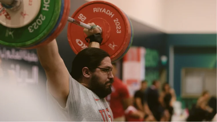 Caine Wilkes practices at the 2023 World Weightlifting Championships