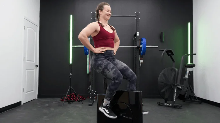 Our tester training atop the Sharper Image Space Saving Stationary Bike