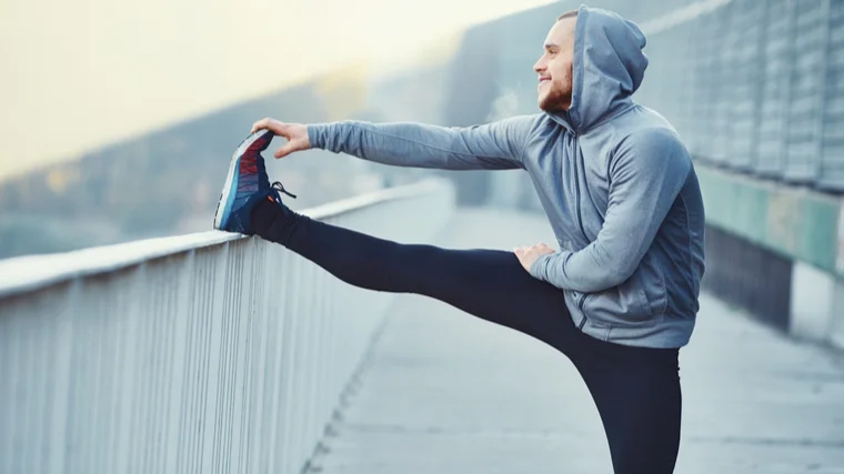 man doing stretch for warm-up