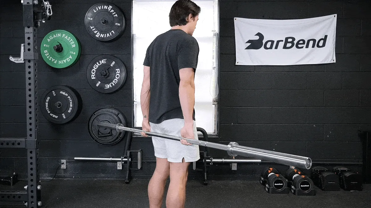 Our tester doing the behind-the-back barbell wrist curls.