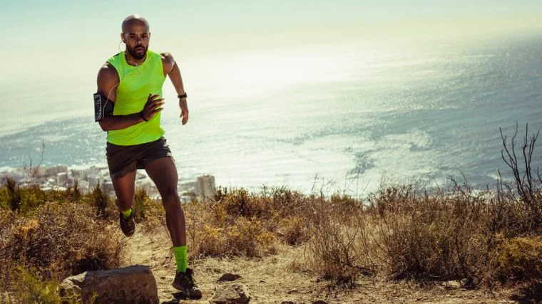 An athlete running on a trail instead of the road.