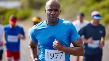 A person running from the couch to 5k, with other people running in the background.