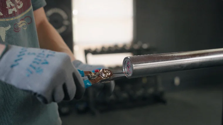 Jake Reassembling the Loading Sleeves of a Barbell