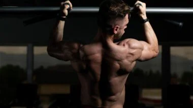 A person working out their biceps with neutral grip pull-ups.