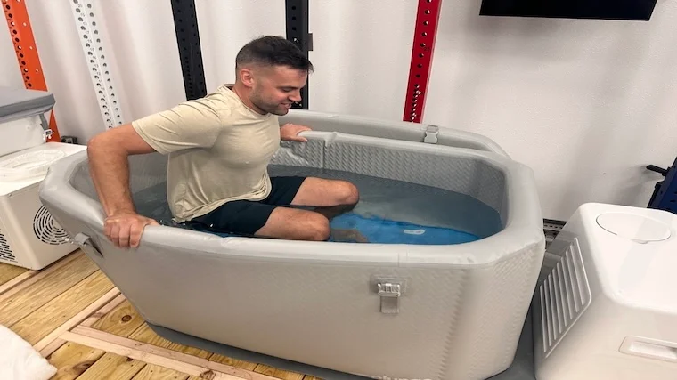 Our tester getting into the Plunge Air cold plunge tub