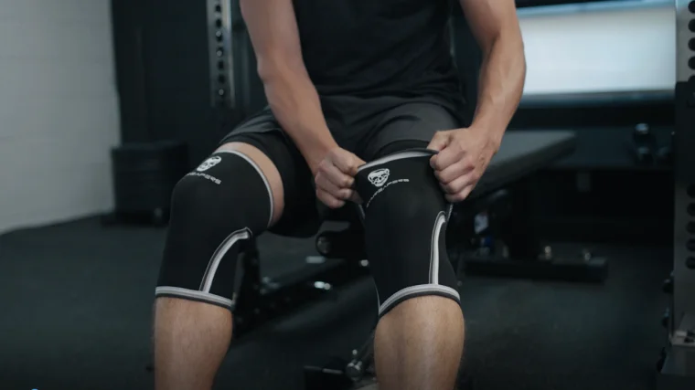Jake Putting on the Gymreapers Knee Sleeves