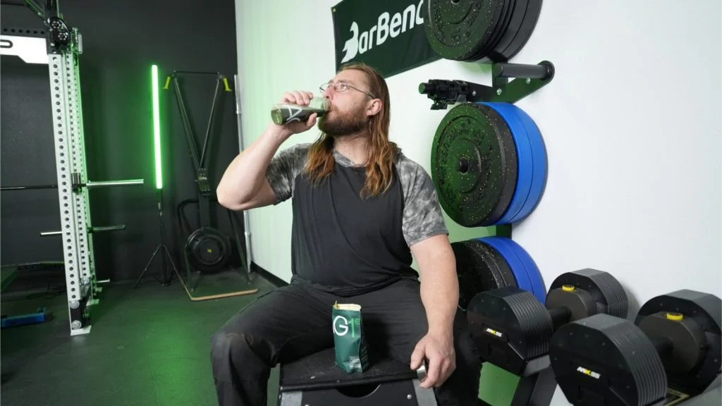 ag1-greens-supplement-drinking-mixed-greens (1) Our tester drinking AG1 greens supplement drink