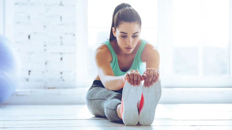 woman testing hamstring mobility 