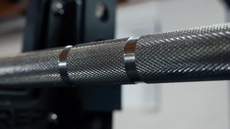 knurling on the again faster pursuit olympic bar