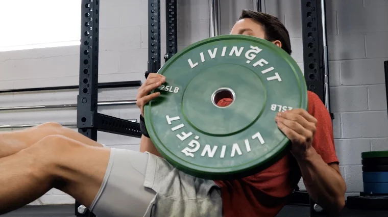 Jake Doing Russian Twists with the Living.Fit Weight Plates