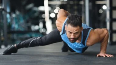 Person does muscle ups in the gym