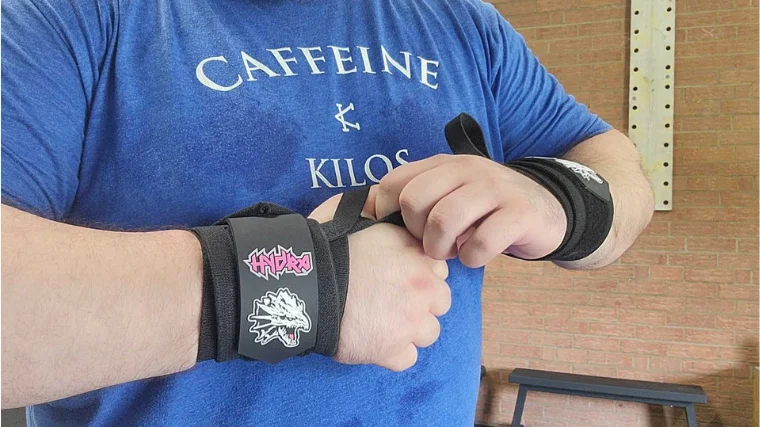 bells-of-steel-mighty-wrist-wraps-on-athlete Tester adjusts their Bells of Steel Wrist Wraps.