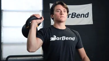 Our tester performing the kettlebell circuit workout in the BarBend gym.