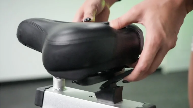 Seat cushion adjustment on the Bells of Steel Blitz Air Bike.