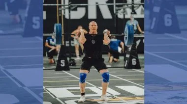 A competitor is shown lifting in this featured image