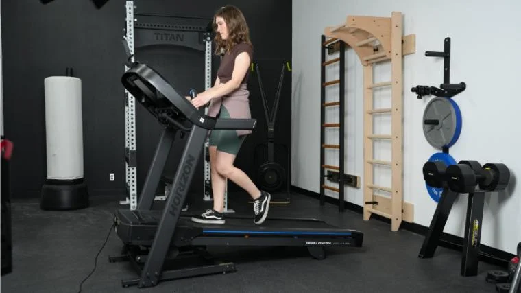 a person walking on the Horizon 7.0 AT Treadmill