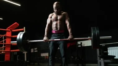 A person deadlifting a barbell.