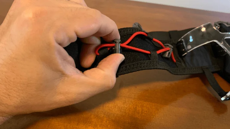 A closeup of the Nathan Sports Trailmix Plus 3.0 running belt's bungee.