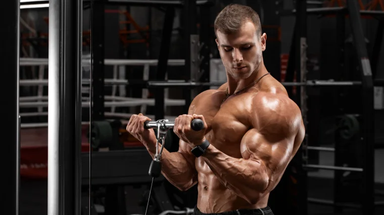A bodybuilder showing his shoulder muscles.