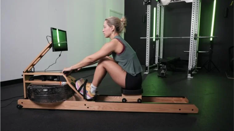 Our tester using the Ergatta Lite Rower.