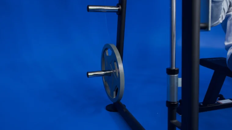 The extra weight plate storage horns at the back of the Titan Fitness Smith Machine
