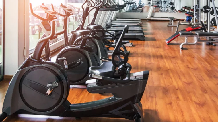 Exercise bikes in a gym that include recumbent and upright bikes. 