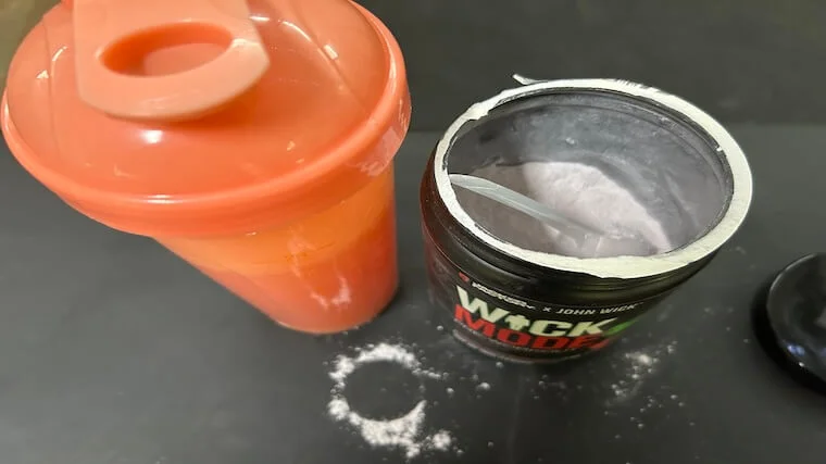 An open container of Jacked Factory Wick Mode pre-workout
