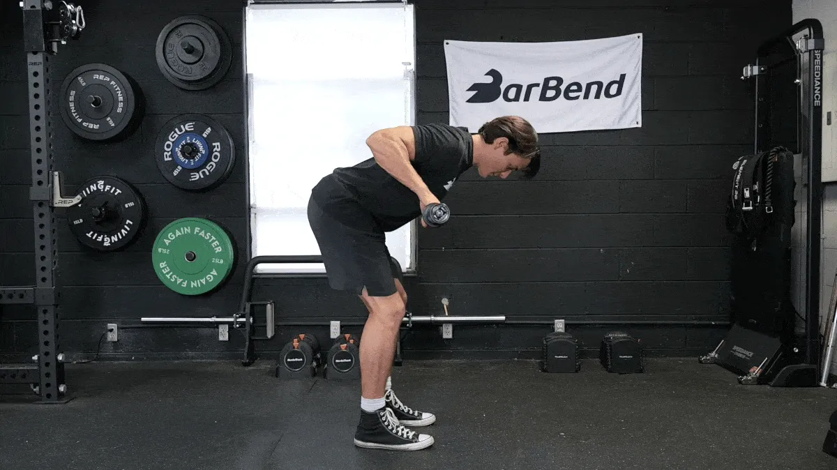 BarBend's Jake Herod performing the barbell row exercise.