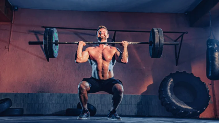 A muscular person lifting a barbell.