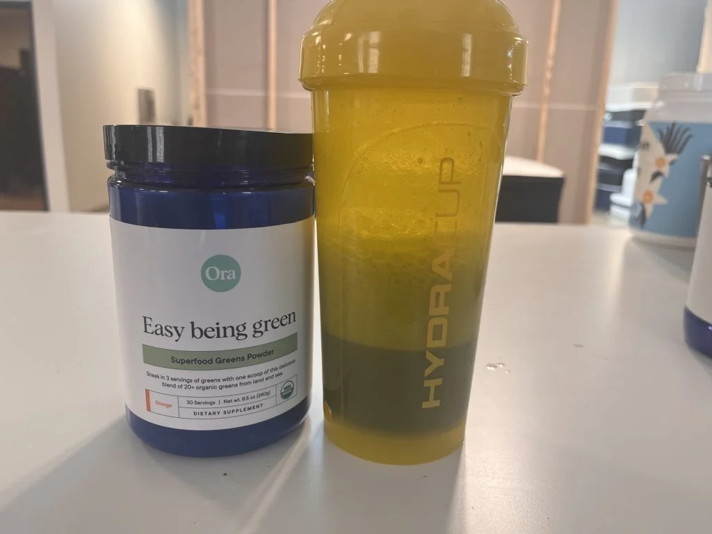 ora-organic-greens-with-shaker-cup Ora Organic Greens with a shaker cup.