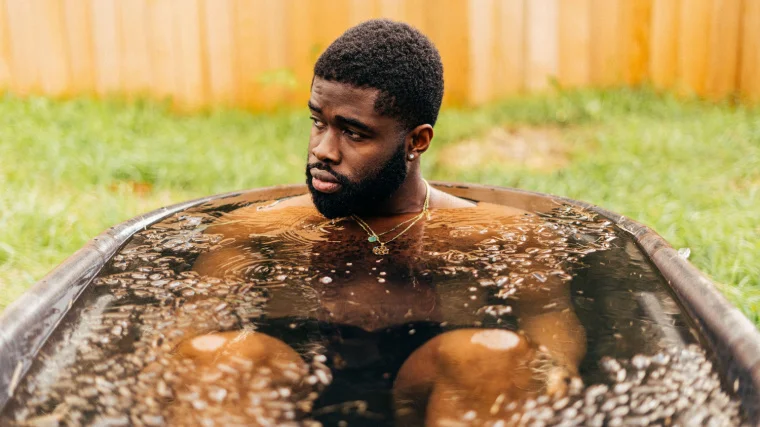 A fit person doing a cold water immersion.