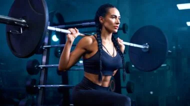 A person doing a barbell Bulgarian split squat