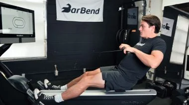 A person doing a rowing machine workout for weight loss.