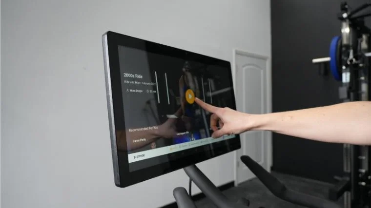 Our BarBend tester starting a workout on the Stryde Bike.