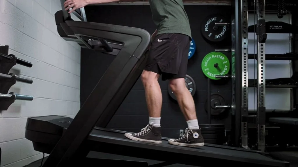 Our tester walking on an incline treadmill.