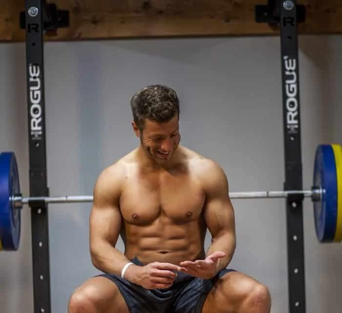 Jake Boly sitting on bench