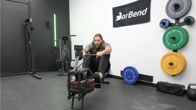 Our tester using the YOSUDA Water Rowing Machine.
